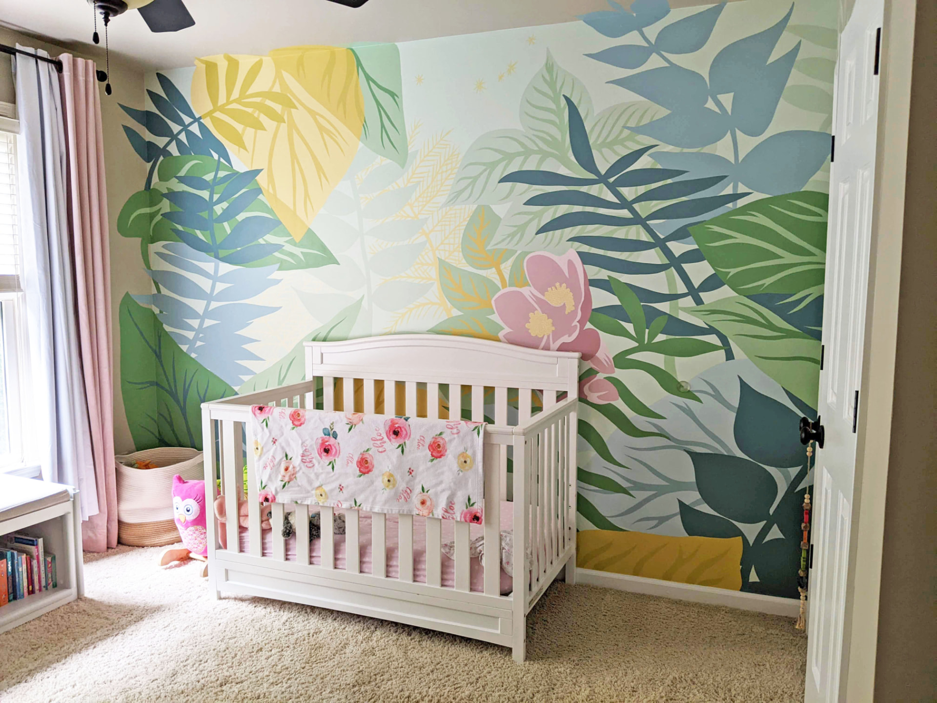 Soft botanical nursery mural by Wonderwall Murals